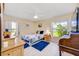 Bright bedroom with a queen bed, large windows, and wood dresser at 9125 39Th N Ln, Pinellas Park, FL 33782