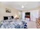 Comfortable bedroom with a queen bed, ceiling fan, and ample closet space at 9125 39Th N Ln, Pinellas Park, FL 33782
