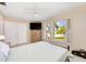Bedroom with double bed, large window with shutters, and dresser at 9125 39Th N Ln, Pinellas Park, FL 33782