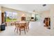 Bright dining area with wood table and chairs, view to backyard at 9125 39Th N Ln, Pinellas Park, FL 33782