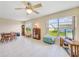Bright dining area with wood table and chairs, view to backyard at 9125 39Th N Ln, Pinellas Park, FL 33782
