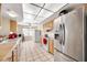 Kitchen with stainless steel appliances and light wood cabinets at 9125 39Th N Ln, Pinellas Park, FL 33782