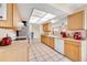 Kitchen with light wood cabinets, stainless steel appliances at 9125 39Th N Ln, Pinellas Park, FL 33782