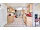 Kitchen with light wood cabinets, stainless steel appliances at 9125 39Th N Ln, Pinellas Park, FL 33782