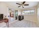 Sunroom with tiled floor, sliding doors, and access to outdoors at 9125 39Th N Ln, Pinellas Park, FL 33782