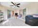 Sunroom with tiled floor, sliding glass doors, and backyard access at 9125 39Th N Ln, Pinellas Park, FL 33782