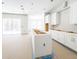 Modern kitchen island and white cabinets at 22426 Golden Retriever Ln, Brooksville, FL 34601