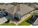 Aerial view of the house showing roofline and landscaping at 31932 Stillmeadow Dr, Wesley Chapel, FL 33543