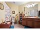 Bathroom with wood cabinets and floral shower curtain at 31932 Stillmeadow Dr, Wesley Chapel, FL 33543