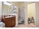 Bathroom with walk-in shower, double sinks, and linen closet at 31932 Stillmeadow Dr, Wesley Chapel, FL 33543