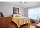 Bright bedroom with hardwood floors and large window at 31932 Stillmeadow Dr, Wesley Chapel, FL 33543