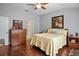 Bedroom with hardwood floors and ensuite bathroom access at 31932 Stillmeadow Dr, Wesley Chapel, FL 33543