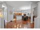 Open concept dining area adjacent to the kitchen with hardwood floors at 31932 Stillmeadow Dr, Wesley Chapel, FL 33543