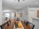 Spacious dining area with hardwood floors and views to entry and kitchen at 31932 Stillmeadow Dr, Wesley Chapel, FL 33543