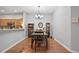 Dining room features hardwood floors and kitchen access at 31932 Stillmeadow Dr, Wesley Chapel, FL 33543