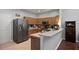 Modern kitchen with ample cabinetry, stainless steel appliances, and a breakfast bar at 31932 Stillmeadow Dr, Wesley Chapel, FL 33543