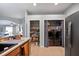 Convenient laundry area with washer, dryer, and shelving at 31932 Stillmeadow Dr, Wesley Chapel, FL 33543