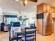 Kitchen and dining area with wood table, chairs and stainless steel fridge at 4201 Neil Ln, Bradenton, FL 34208