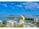 Stunning aerial view highlighting waterfront location and city skyline at 8 Belleview Blvd # 408, Belleair, FL 33756