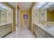Bright bathroom with double sinks and a separate shower at 8 Belleview Blvd # 408, Belleair, FL 33756