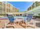 Inviting pool area with lounge chairs for relaxation at 8 Belleview Blvd # 408, Belleair, FL 33756