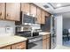 Updated kitchen showcasing stainless steel appliances, ample cabinet space, and modern design elements at 5479 Pinehurst Dr, Spring Hill, FL 34606