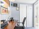 Cozy home office space featuring a wooden desk, a comfortable chair, and ample natural light at 5479 Pinehurst Dr, Spring Hill, FL 34606