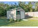 Exterior view of backyard storage shed on a sunny day at 5479 Pinehurst Dr, Spring Hill, FL 34606