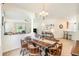 Open concept dining room adjacent to the living room and kitchen, perfect for entertaining guests at 10954 May Apple Ct, Land O Lakes, FL 34638