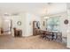 Bright dining room featuring a traditional hutch and an abundance of natural light at 10954 May Apple Ct, Land O Lakes, FL 34638