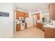 Spacious kitchen featuring oak cabinetry, white appliances, and durable flooring at 10954 May Apple Ct, Land O Lakes, FL 34638