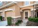 Front entrance of townhouse with stone accents and landscaping at 11833 Castine St, New Port Richey, FL 34654