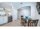 Kitchen features breakfast nook, stainless steel appliances, and white cabinetry at 11833 Castine St, New Port Richey, FL 34654