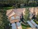 Aerial view of three-unit townhouse building with garages and landscaping at 11833 Castine St, New Port Richey, FL 34654