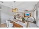 Dining room with a large wooden table and view into the living room at 5502 Limelight Dr, Apollo Beach, FL 33572