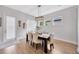 Inviting dining room with contemporary decor, complemented by lots of natural light and hardwood floors at 5502 Limelight Dr, Apollo Beach, FL 33572