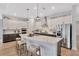 Modern kitchen with quartz countertops, stainless steel appliances, and stylish two-tone cabinetry at 5502 Limelight Dr, Apollo Beach, FL 33572