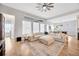 Bright living room featuring hardwood floors and sectional sofa at 5502 Limelight Dr, Apollo Beach, FL 33572