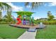 Community playground with shaded structure and play equipment at 5502 Limelight Dr, Apollo Beach, FL 33572