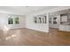 Bright and airy living room with hardwood floors and large windows at 3611 E Renellie Cir, Tampa, FL 33629