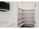 Bright walk-in pantry with ample shelving at 3611 E Renellie Cir, Tampa, FL 33629