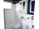 Clean bathroom with white tile, a tub, and vanity at 4254 96Th N Ter # Two, Pinellas Park, FL 33782