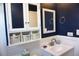 Bathroom with a navy blue accent wall and updated vanity at 4254 96Th N Ter # Two, Pinellas Park, FL 33782