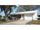 White single-story home with a two-car garage and mature landscaping at 4254 96Th N Ter # Two, Pinellas Park, FL 33782