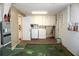 Interior view of garage with washer, dryer, and storage cabinets at 4254 96Th N Ter # Two, Pinellas Park, FL 33782