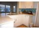 Updated kitchen featuring white cabinets and a tile backsplash at 4254 96Th N Ter # Two, Pinellas Park, FL 33782
