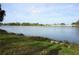 Serene lake view with lush green landscaping and birdlife at 4254 96Th N Ter # Two, Pinellas Park, FL 33782