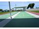 Well-maintained shuffleboard courts with covered seating areas at 4254 96Th N Ter # Two, Pinellas Park, FL 33782