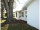 View of the home's side, showing additional landscaping at 4254 96Th N Ter # Two, Pinellas Park, FL 33782