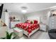 Large bedroom with a king-size bed, white headboard, and decorative accents at 4608 Apple Ridge Ln, Tampa, FL 33624